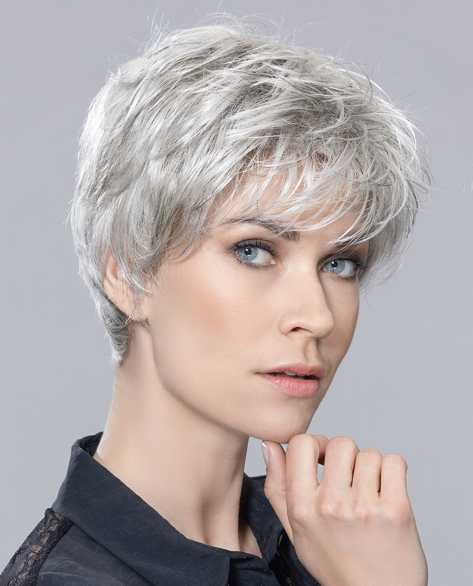 Front view of a woman modeling the elegant Ellen Wille Ziza short wig, showcasing its chic cropped layers, sophisticated texture, and natural volume.