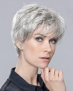 Front view of a woman modeling the elegant Ellen Wille Ziza short wig, showcasing its chic cropped layers, sophisticated texture, and natural volume.