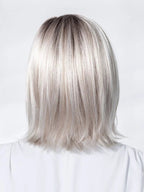 Icone Small Deluxe by Ellen Wille, three-quarter view showing the polished mid-length silhouette and natural-looking synthetic texture.