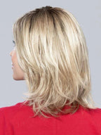 Lucky Mono Part wig by Ellen Wille, lifestyle view showing the layered mid-length bob and side-swept fringe with monofilament parting.