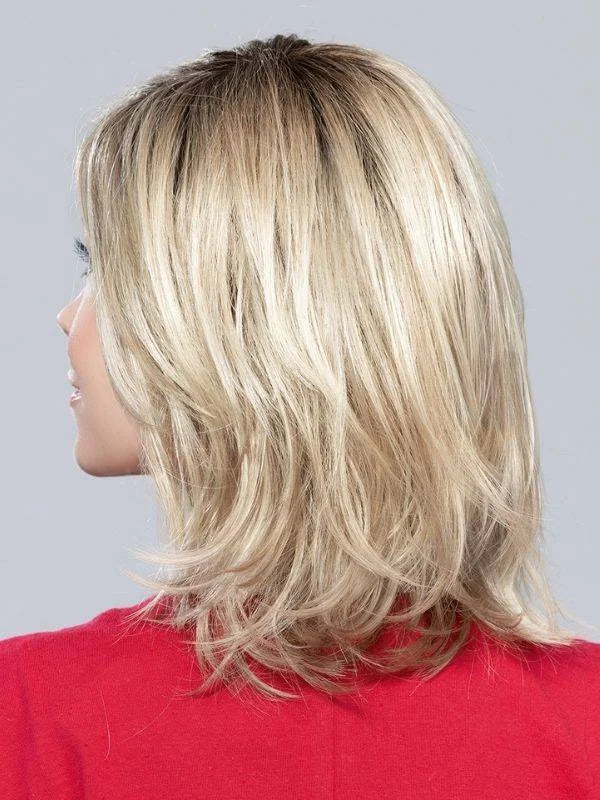 Lucky Mono Part wig by Ellen Wille, lifestyle view showing the layered mid-length bob and side-swept fringe with monofilament parting.