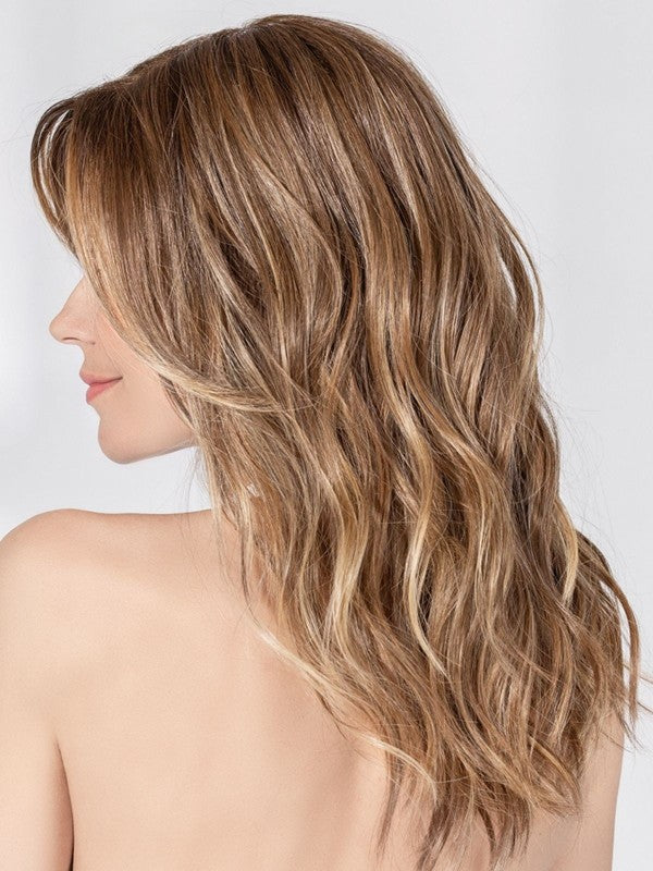 Fantasy Small Deluxe wig by Ellen Wille, lifestyle view showing the long wavy style and heat-resistant synthetic fiber of the Hair Society collection.