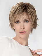 Avenue Small Soft by Ellen Wille, lifestyle front view showing the short heat-resistant synthetic wig and medical comfort cap.