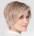 Glam Soft wig by Ellen Wille, lifestyle view showing the short asymmetric cut and heat-resistant synthetic fiber.