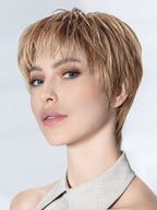 Novel Deluxe in Dark Sand by Ellen Wille, side profile showing the natural sandy tone on the short sleek synthetic wig.