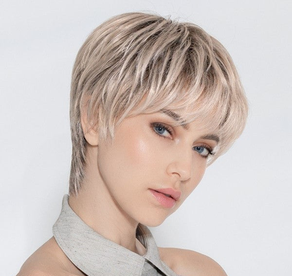 Novel Deluxe wig by Ellen Wille, lifestyle view showing the short sleek cut and heat-resistant synthetic fiber.