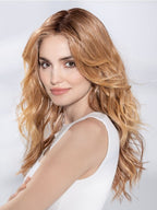 Ellen Wille Sparkle Deluxe in Toffee Blonde, side profile showing the warm toffee gradient on the long wavy heat-resistant wig.