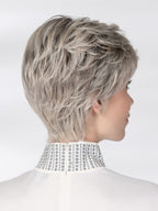 Posh Deluxe wig by Ellen Wille, lifestyle view showing the short cut with elongated nape and premium synthetic fiber.