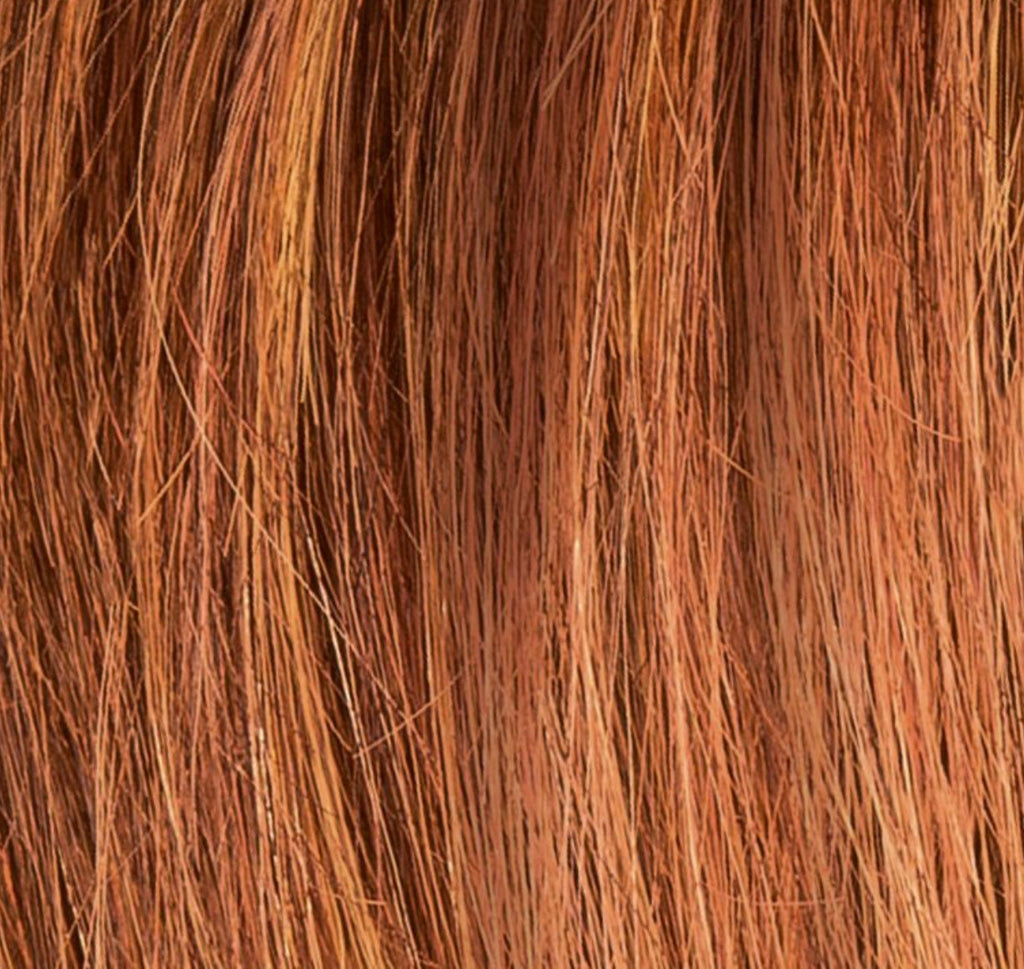 Miss Comfort in Safran Red Rooted by Ellen Wille, side view showing the vibrant copper red tone on the mid-length wig.