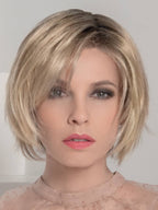 Star Deluxe in Sandy Blonde by Ellen Wille, three-quarter view showing the warm blonde tone on the short synthetic bob.